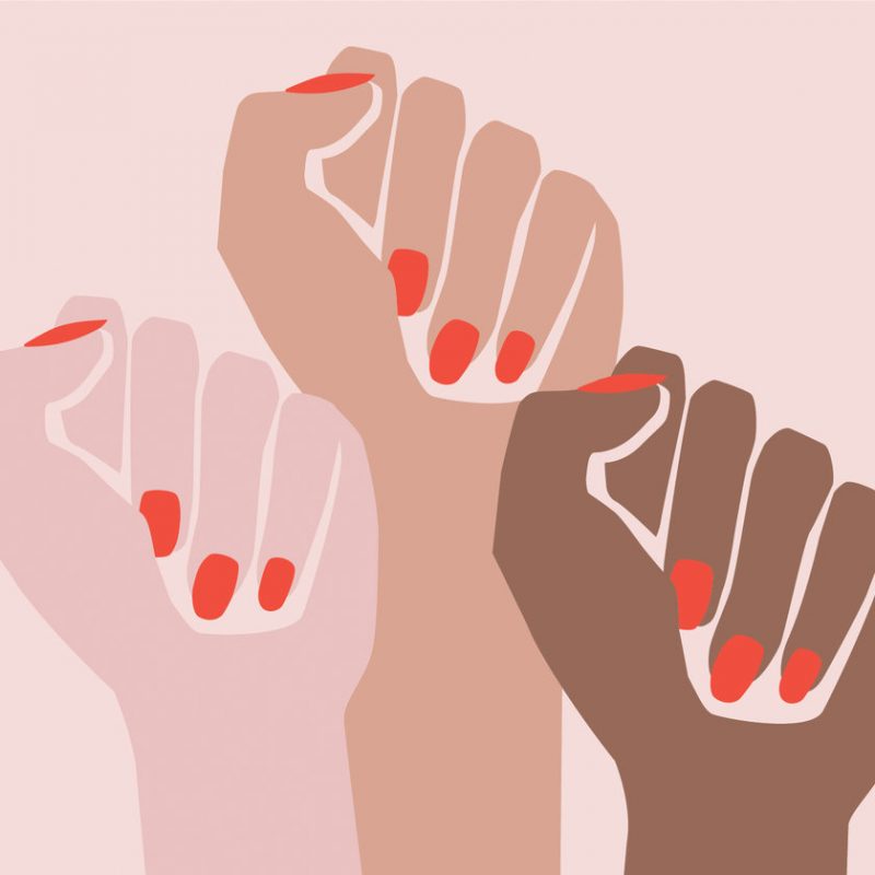 Feminism in design. Female hands forming fists