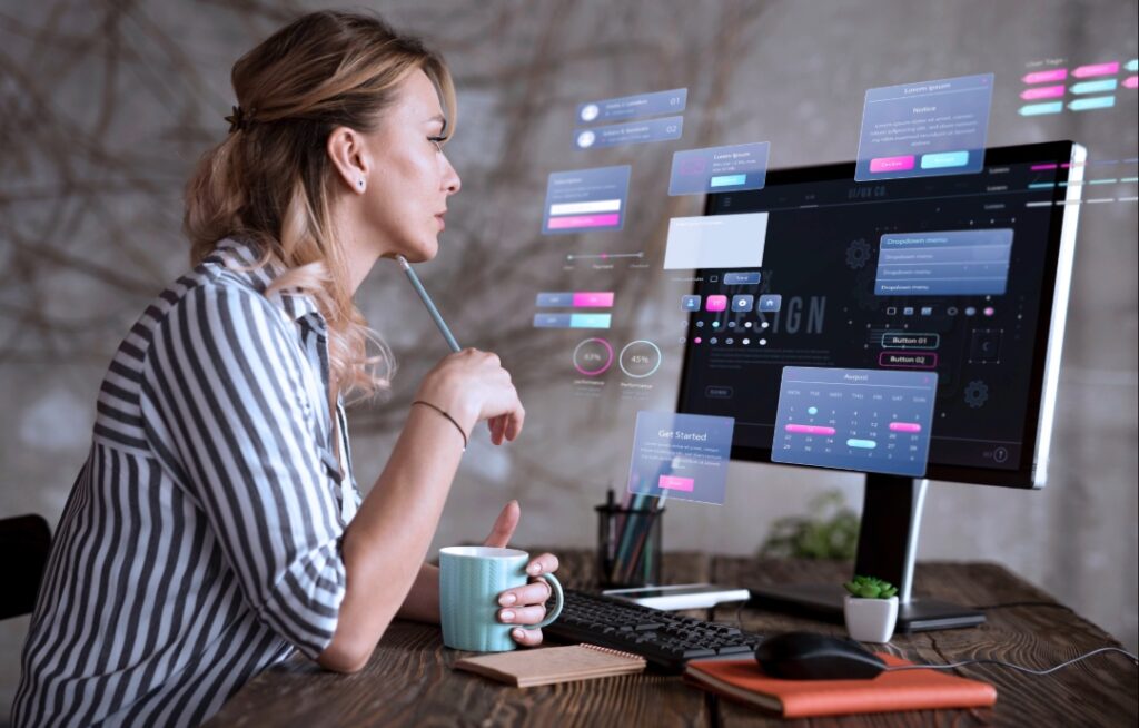 Woman working on website re-design on her laptop