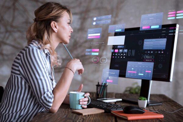 Woman working on website re-design on her laptop