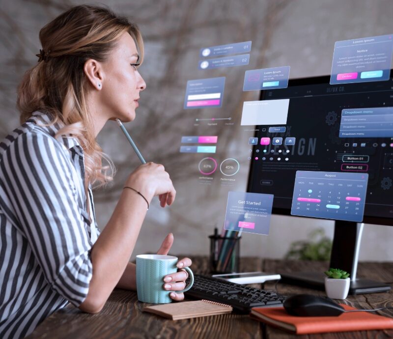 Woman working on website re-design on her laptop